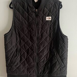 The North Face Black Vest with Quilted Design and Full-Length Zipper